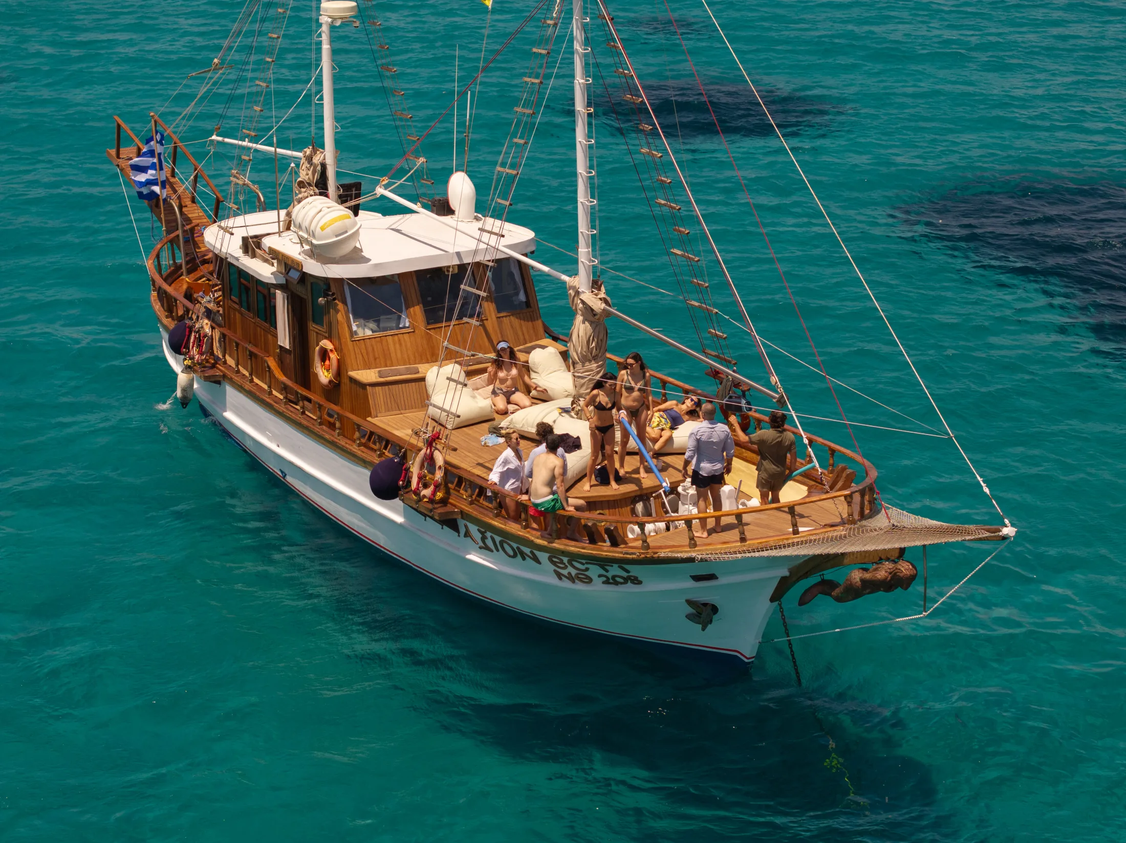AXION ESTI cruising on clear Athenian Riviera water
