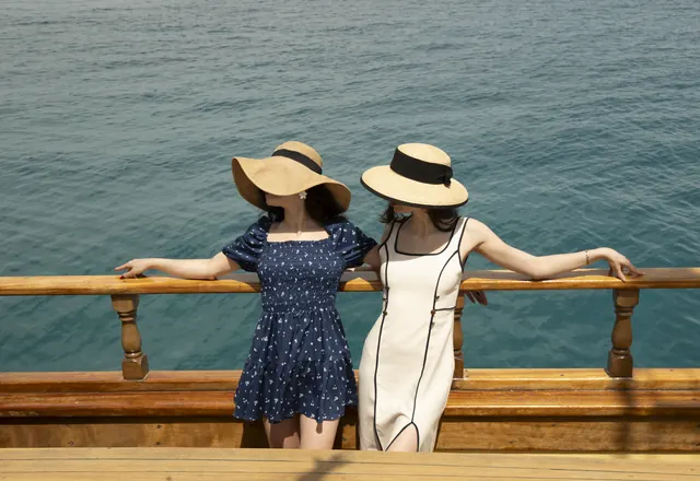 Guests looking out to sea from the yacht